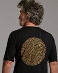 Man modeling a crew neck t shirt with gold graphics