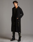 Man modeling a duster with gold graphics