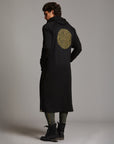 Man modeling a duster with gold graphics