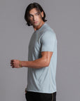 Male modeling agave teal ultimate tee shirt