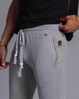 A man modeling Deep Clay gray colored jogger pants