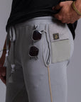 A man modeling Deep Clay gray colored jogger pants