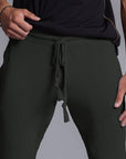 A man modeling Urban Forest green colored jogger pants