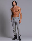 A man modeling Deep Clay gray colored jogger pants