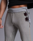 A man modeling Deep Clay gray colored jogger pants