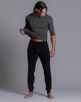 A man modeling black colored jogger pants