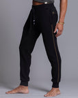 A man modeling black colored jogger pants