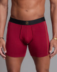A man modeling the One Golden Thread Unders in Wine Red