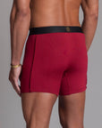 A man modeling the One Golden Thread Unders in Wine Red