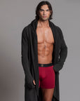 A man modeling the One Golden Thread Unders in Wine Red