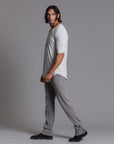 Man modeling the milano pant in deep clay gray