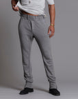 Man modeling the milano pant in deep clay gray