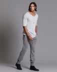 Man modeling the milano pant in deep clay gray