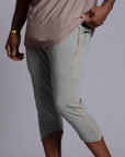 Male modeling Green Clay colored yogo mid shorts