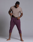 Male modeling Eggplant colored yogo mid pants