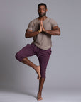 Male modeling Eggplant colored yogo mid pants