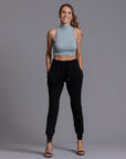 A woman modeling the One Golden Thread Jogga Pants in Black