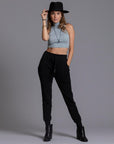 A woman modeling the One Golden Thread Jogga Pants in Black