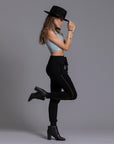 A woman modeling the One Golden Thread Jogga Pants in Black