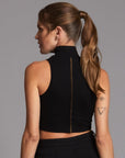 Woman modeling high neck crop in Black