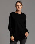 Woman modeling long sleeve crew shirt in black