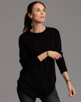 Woman modeling long sleeve crew shirt in black