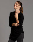 Woman modeling long sleeve crew shirt in black