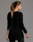 Woman modeling long sleeve crew shirt in black