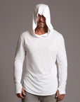 Man modeling white long-sleeve hooded tee