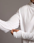 Man modeling white long-sleeve hooded tee