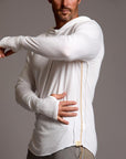 Man modeling white long-sleeve hooded tee