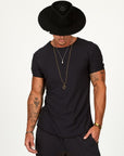 Male modeling black crew neck shirt