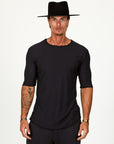 Male modeling black crew neck shirt