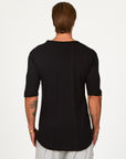 Male modeling black crew neck shirt
