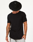 Male modeling black crew neck shirt