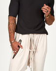 Male modeling White Stone colored pants