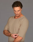 Male modeling tan crew neck shirt