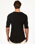 Man modeling a mid sleeve shirt in black