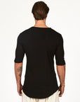Male modeling black v neck shirt