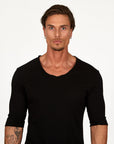 Man modeling a mid sleeve shirt in black