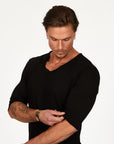Male modeling black v neck shirt