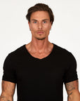 Male modeling black v neck shirt