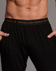 Male modeling the black tree silk pant