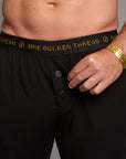 Male modeling the black tree silk pant