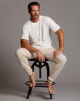 man modeling pants in white stone