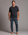man modeling pants in mineral blue