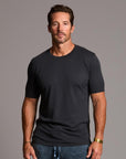 man modeling a tee in charcoal blue