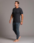 man modeling pants in mineral blue