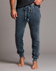 man modeling pants in mineral blue