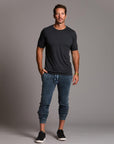 man modeling pants in mineral blue